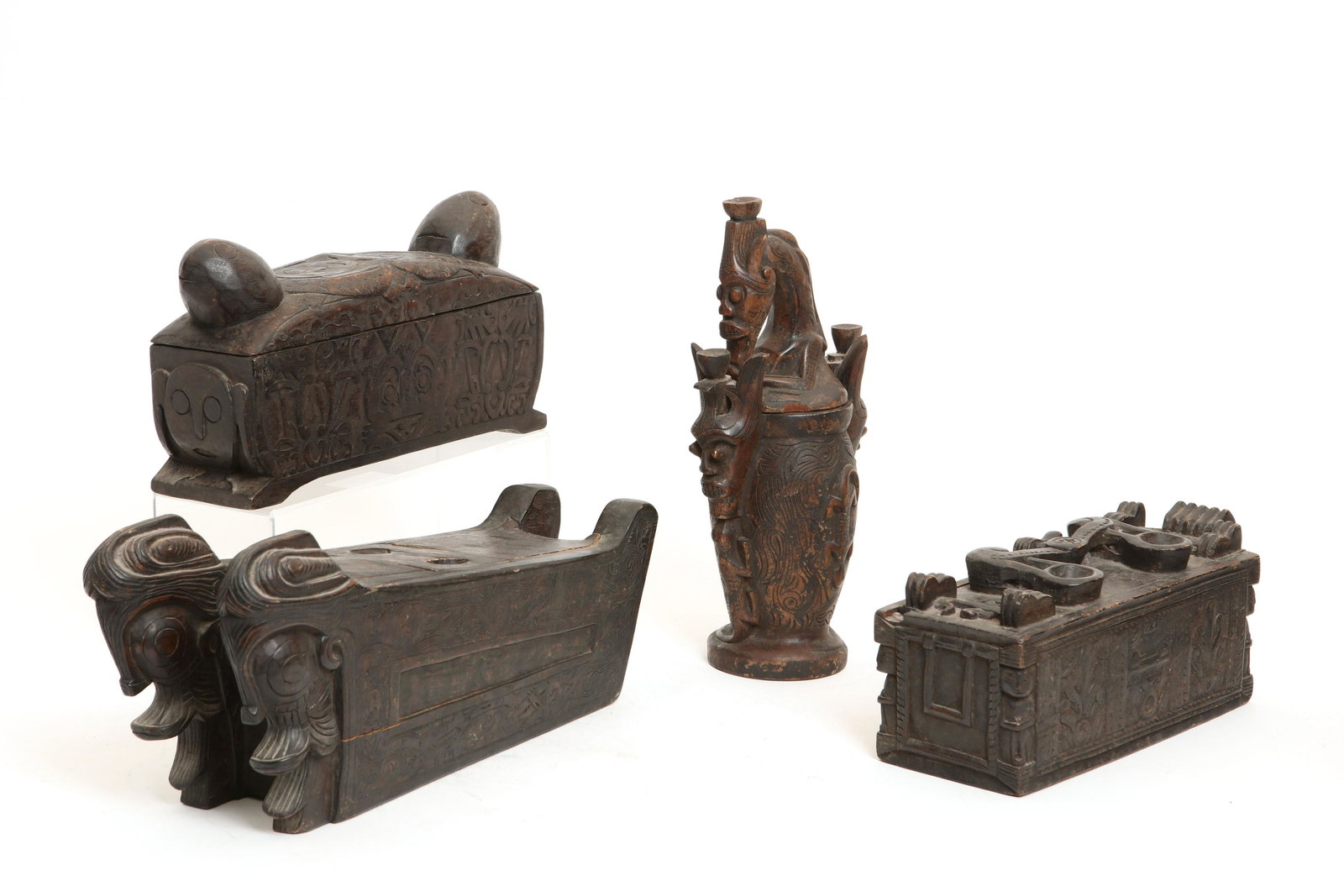 Four Indonesian wood vessels: Four Indonesian wood vessels 20th century height of tallest 14 1/4in (36cm); length of longest 18 1/2in (47cm)