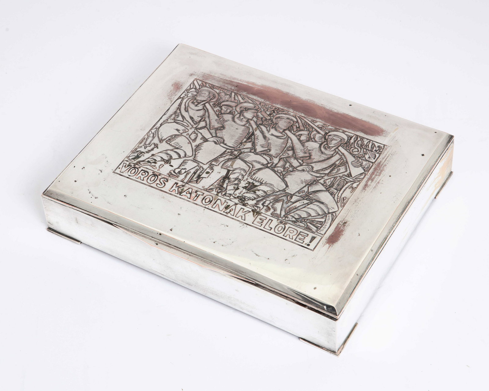 A Hungarian silverplate box: Voros katonak, Elore: A Hungarian silverplate box: Voros katonak, Elore circa 1919 height 2 1/2in (6.5cm); width 13in (33cm); depth 10in (25.5cm) Provenance: Property from the Collection of Edward and Mildred Lewis, Bel-Ai