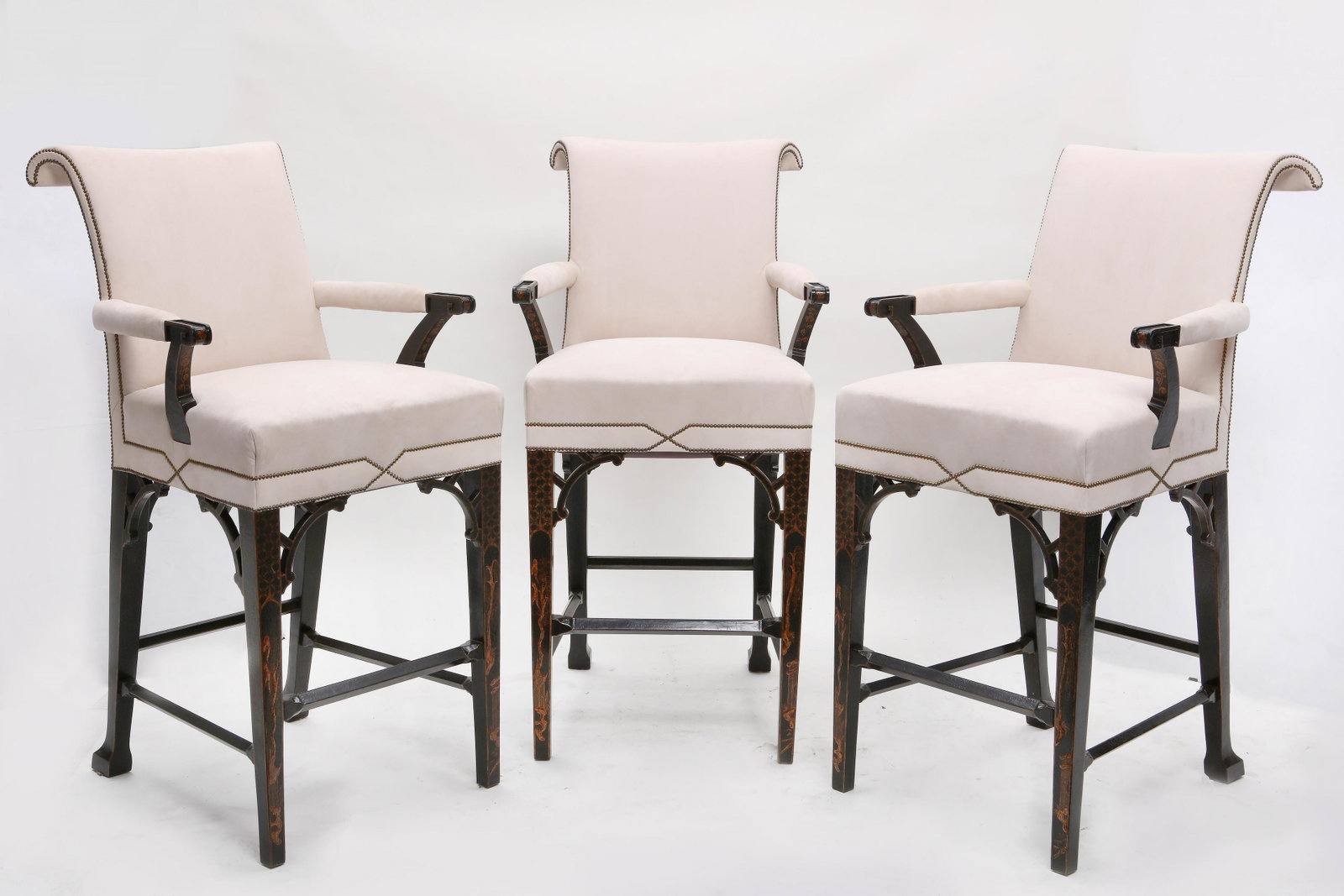 Three Chinese Chippendale style bar stools: A set of three Chinese Chippendale style black lacquered and painted bar stools post 1950 height 48in (122cm); width 24in (61cm); depth of seat 18in (46cm)