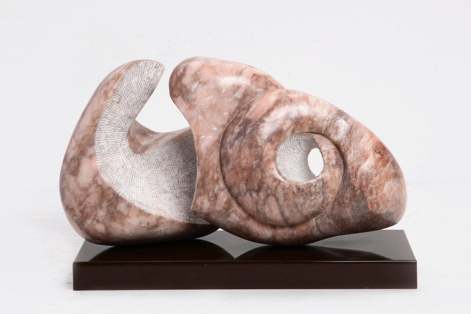 Pat Epstein, alabaster, free form sculpture: Pat Epstein (American, 1924-2015) free form sculpture carved alabaster raised on a hard plastic base height 12in (30.5cm); width 18in (45.5cm); depth 7 3/4in (19.5cm) Provenance: Property from the Est