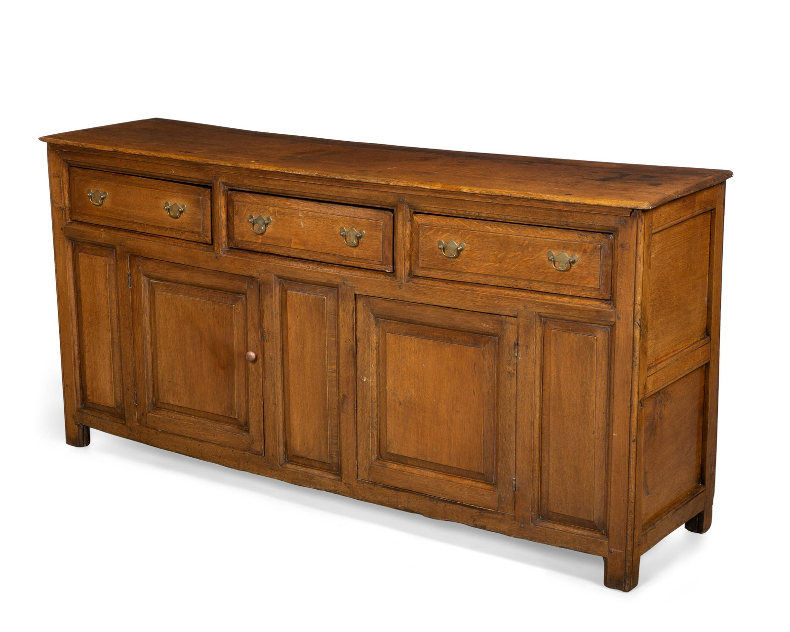 A George III style oak dresser: A George III style oak dresser incorporating antique and later elements height 35 1/2in (90cm); width 73 3/4in (187.5cm); depth 19 1/4in (49cm)