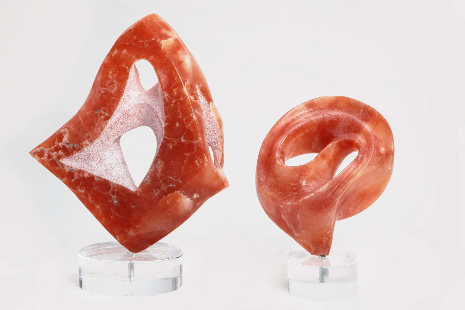 Pat Epstein, alabaster, two free form sculptures: Pat Epstein (American, 1924-2015) two free form sculptures carved alabaster each raised on a lucite base height of tallest 24in (61cm) Provenance: Property from the Estate of Pat and Jerry Epstein res