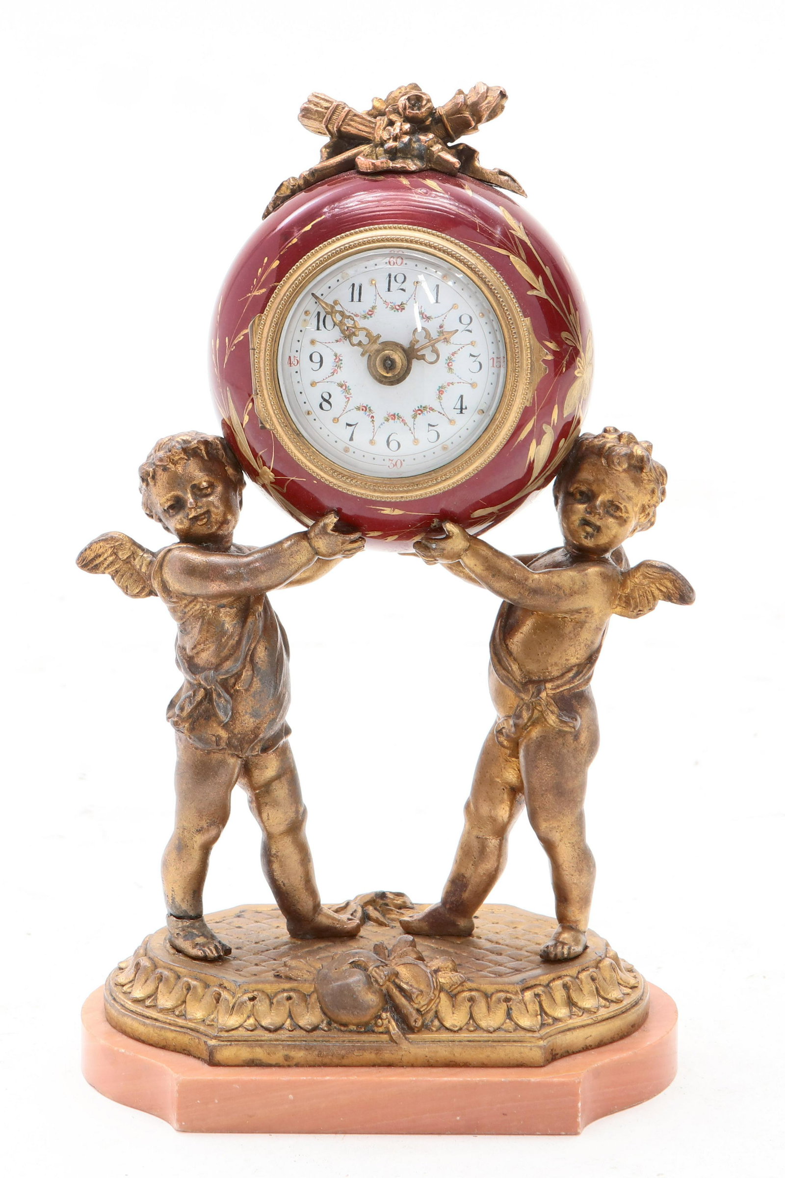 A French gilt bronze figural desk timepiece: A French gilt bronze, earthenware and marble figural desk timepiece early 20th century height 7 3/4in (19.5cm)