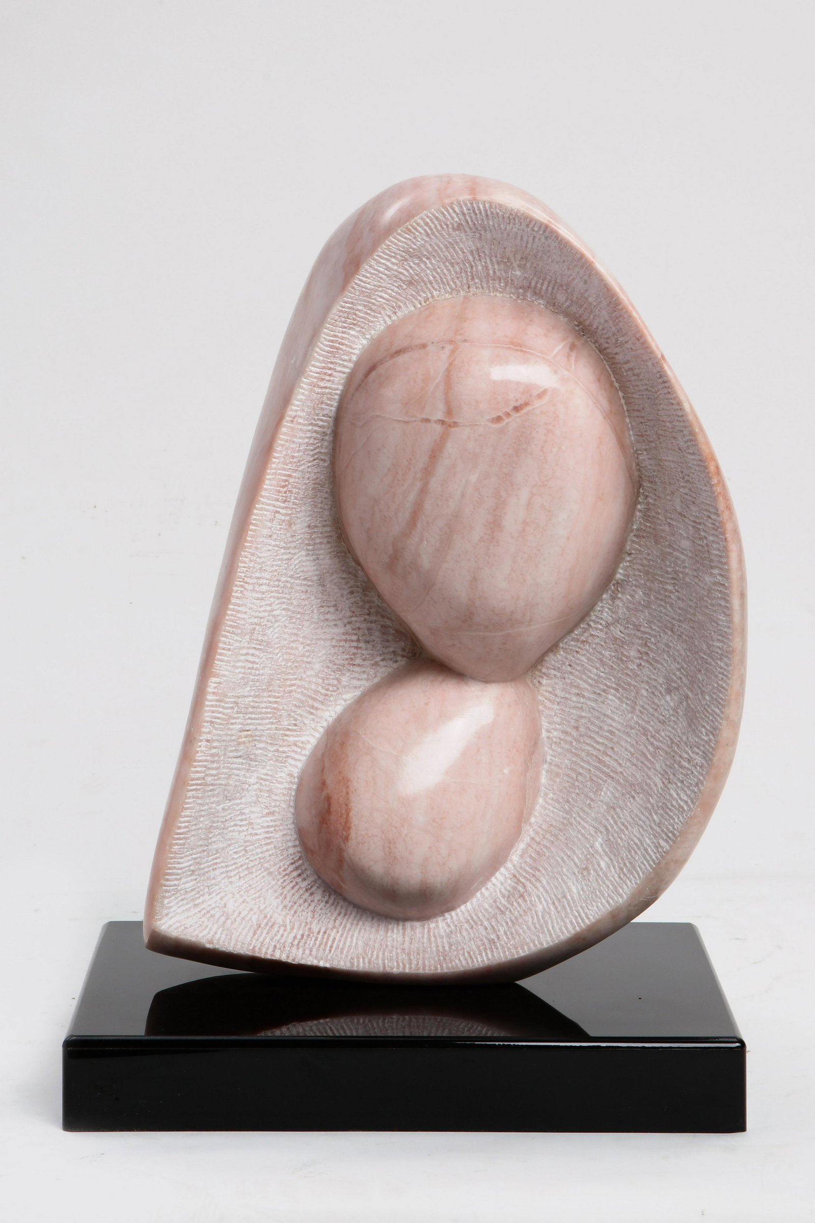 Pat Epstein, alabaster, free form sculpture: Pat Epstein (American, 1924-2015) free form sculpture carved alabaster raised on a granite base 20 1/4in (51.5cm) Provenance: Property from the Estate of Pat and Jerry Epstein residences decorated by 