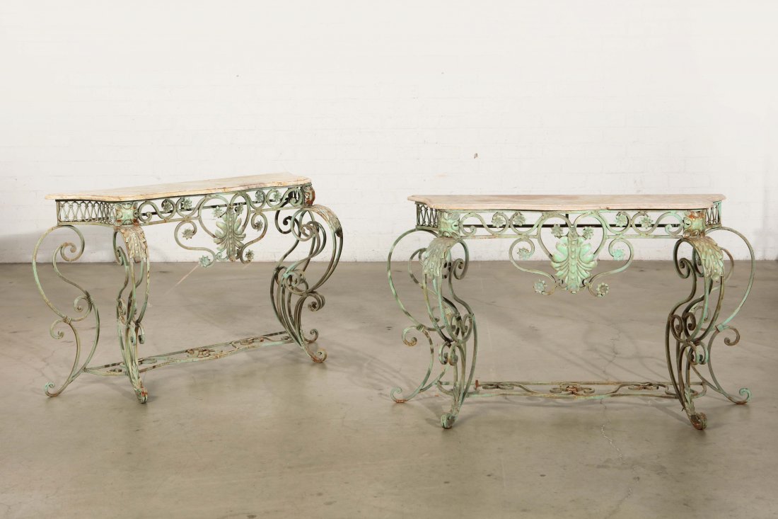 A pair of Baroque style iron console tables: A pair of Baroque style verdigris iron console tables 20th century height 33in (84cm)l width 53in (153cm); depth 19in (48cm) Provenance: Property from a Private Benedict Canyon Collector.