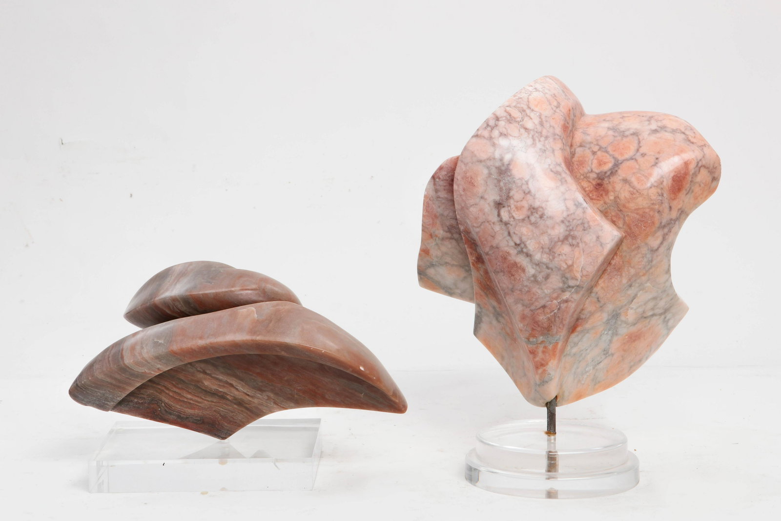 Pat Epstein, alabaster, two free form sculptures: Pat Epstein (American, 1924-2015) two free form sculptures carved alabaster each raised on a lucite base height of tallest 18in (46cm) Provenance: Property from the Estate of Pat and Jerry Epstein res