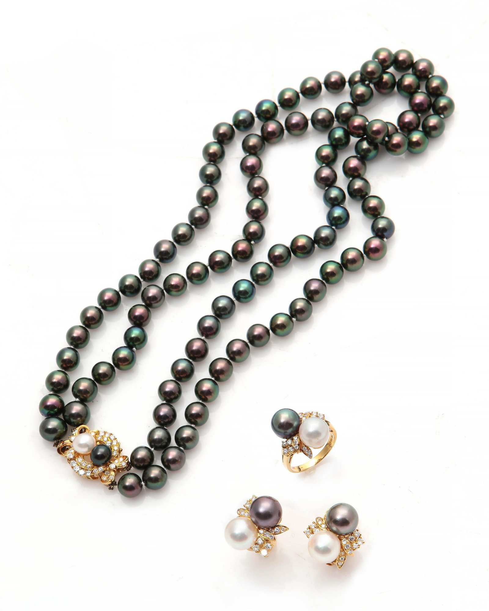 A four pieces of pearl, diamond & gold jewelry: A four piece suite of colored cultured pearl, diamond and 18k gold jewelry comprising a necklace, pair of ear clips and ring; necklace length: 16 1/2in. (42cm); ear clip length: 3/4in. (2cm); ring siz