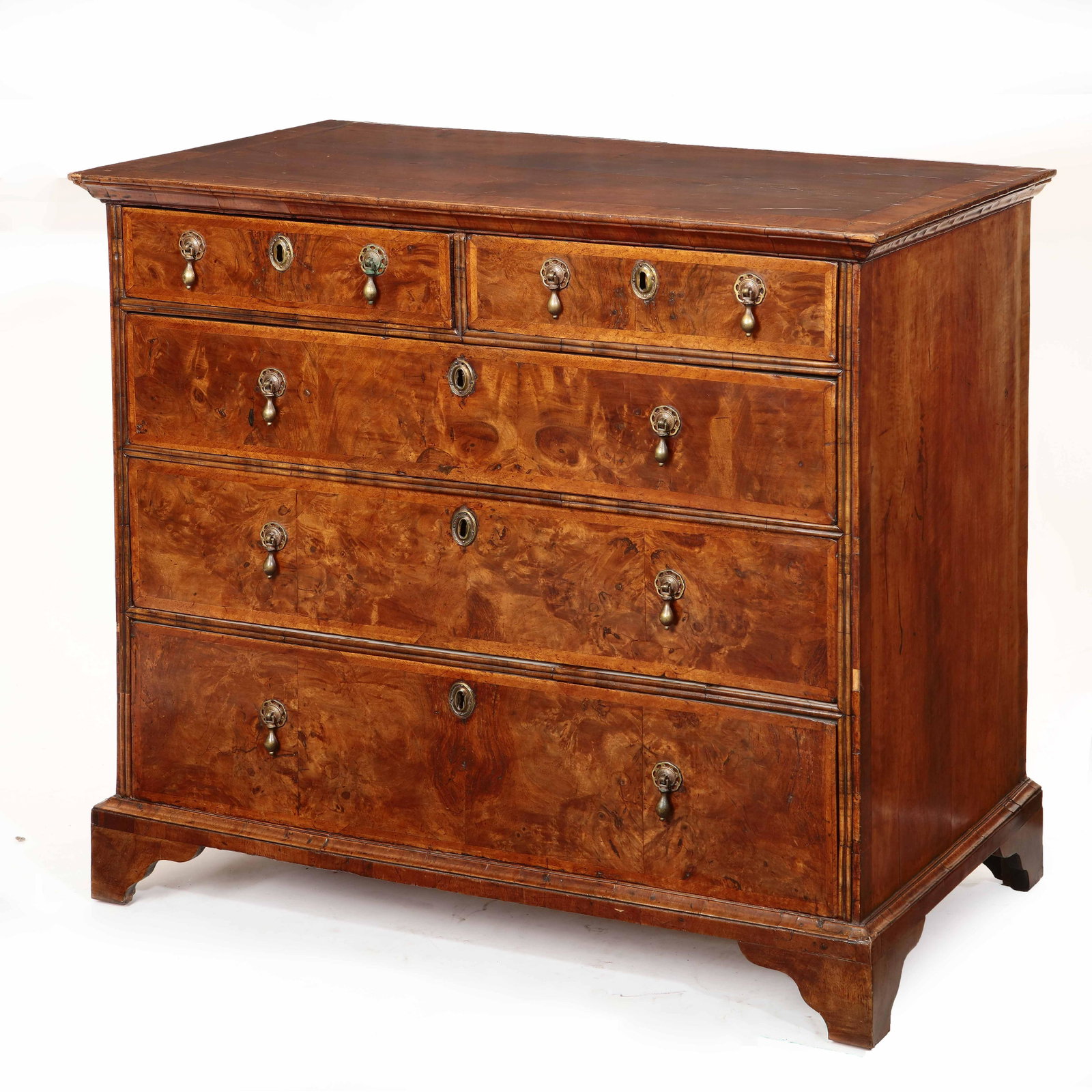 A George I walnut chest of drawers: A George I crossbanded walnut and burl walnut chest of drawers first quarter 18th century height 36in (91.5cm); width 40 1/2in (103cm); depth 22 1/2in (57cm) Provenance: Property from the Estate Franc