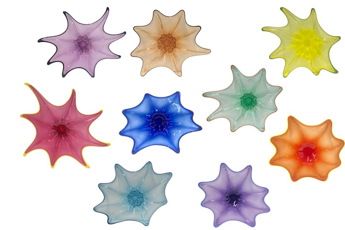 Thomas Kelly nine glass Splatter Platters: Thomas Kelly (American, b. 1967) Nine Splatter Platters, 2006/2007 blown glass Etched Vitrix and 2006 or 2007. largest width 27 1/4in (69cm)Provenance: Property from the Estate of June D. Winkler, Bev