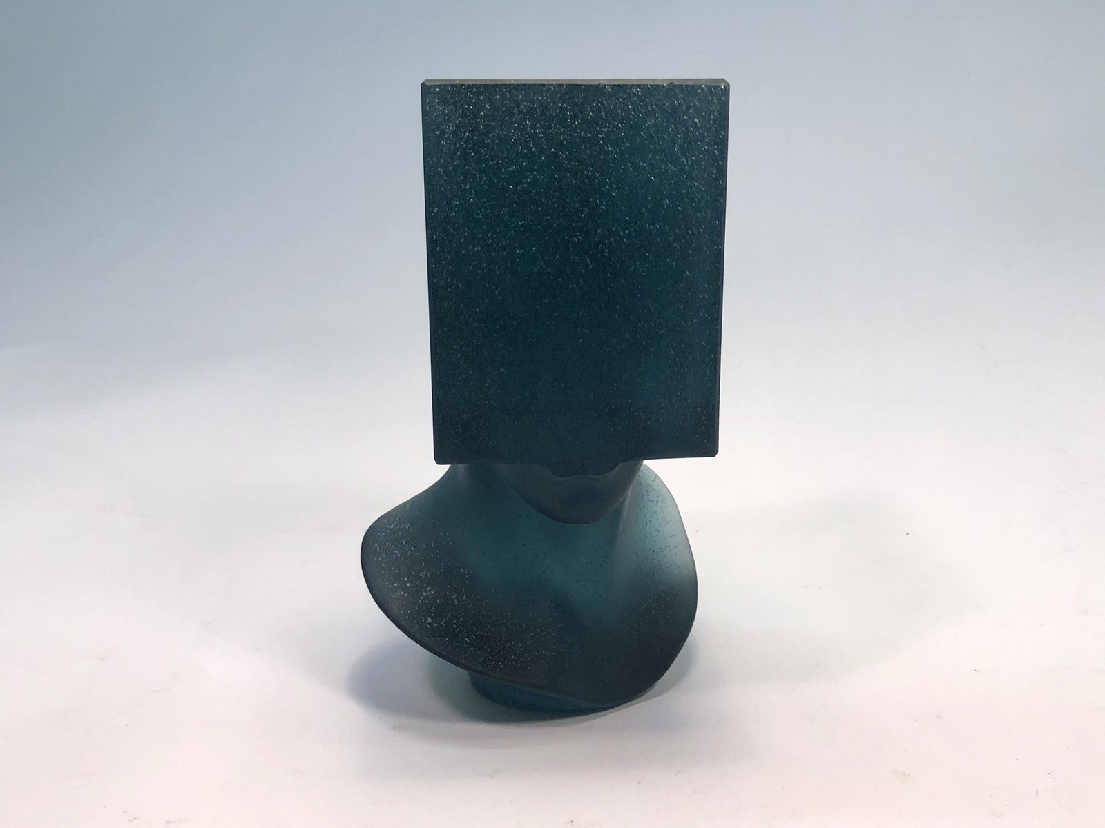 A Daum pate de verre sculpture: Tete au Carre: A Daum limited edition pate de verre sculpture: Tete au Carre designed by Sacha Sosno (French, 1937-2013) Incised Daum France and Sosno, numbered 82/500 H.C. height 6 1/4in (16cm)Provenance: Property