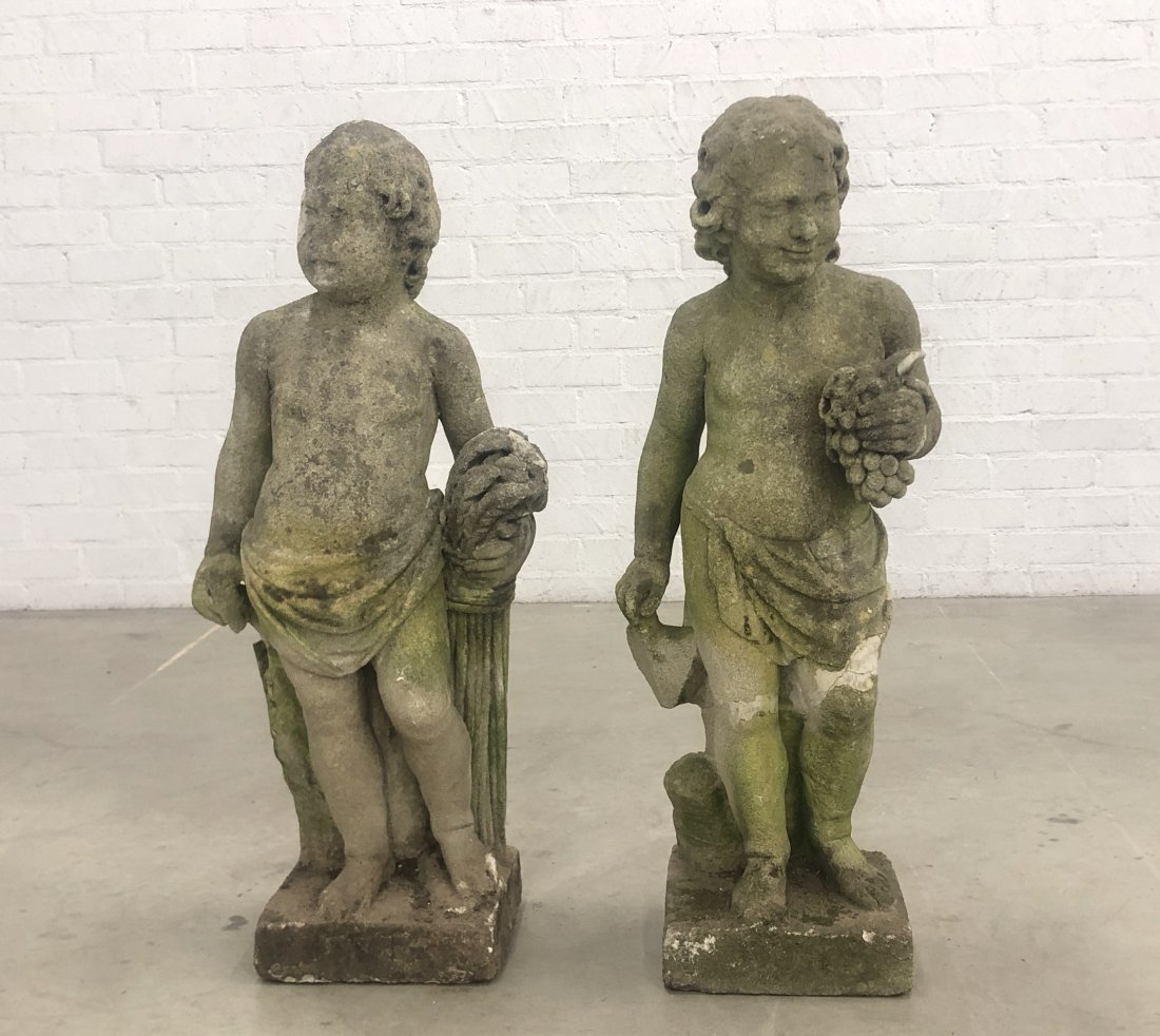 Two limestone putti two of the four seasons: Two limestone allegorical putti depicting two of the four seasons probably late 19th century Autumn and Summer. height 42in (106.5cm); width 19in (48.25cm); depth 12in (30.52cm)