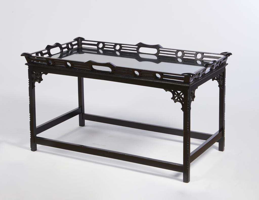 A Chinese Chippendale style ebonized coffee table: A Chinese Chippendale style ebonized coffee table modern height 24in (61cm); width 41 1/4in (104.5cm); depth 23 3/4in (60.5cm)