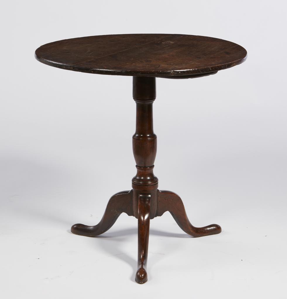 A George III oak and elm tilt top table: A George III oak and elm tilt top occasional table second half 18th century height 26 1/4in (66.5cm); diameter 26 3/4in (68cm)