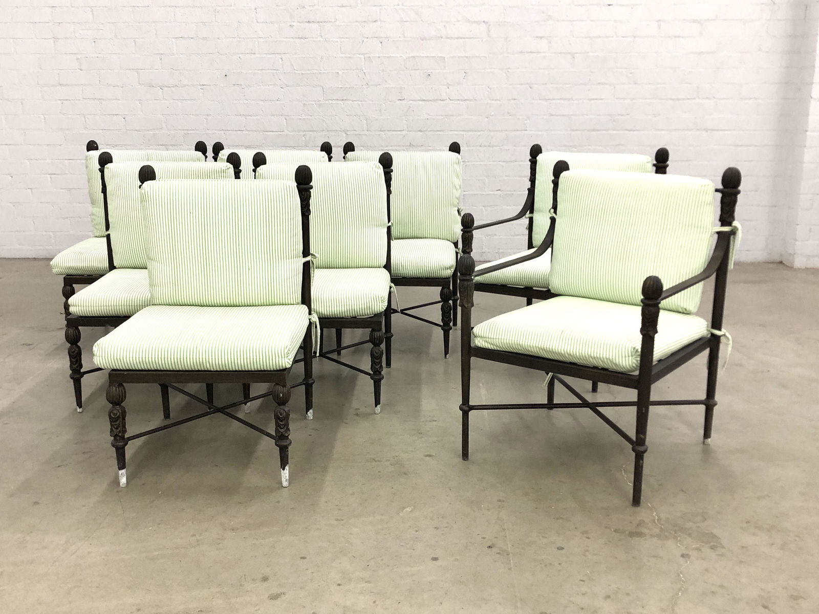 A set of Michael Taylor Montecito garden furniture: A suite of Michael Taylor Montecito garden furnituremodernComprising a dining table and eight side chairs. (9) height of table 30in (76cm); width 43in (109.5cm); length 87in (221cm)