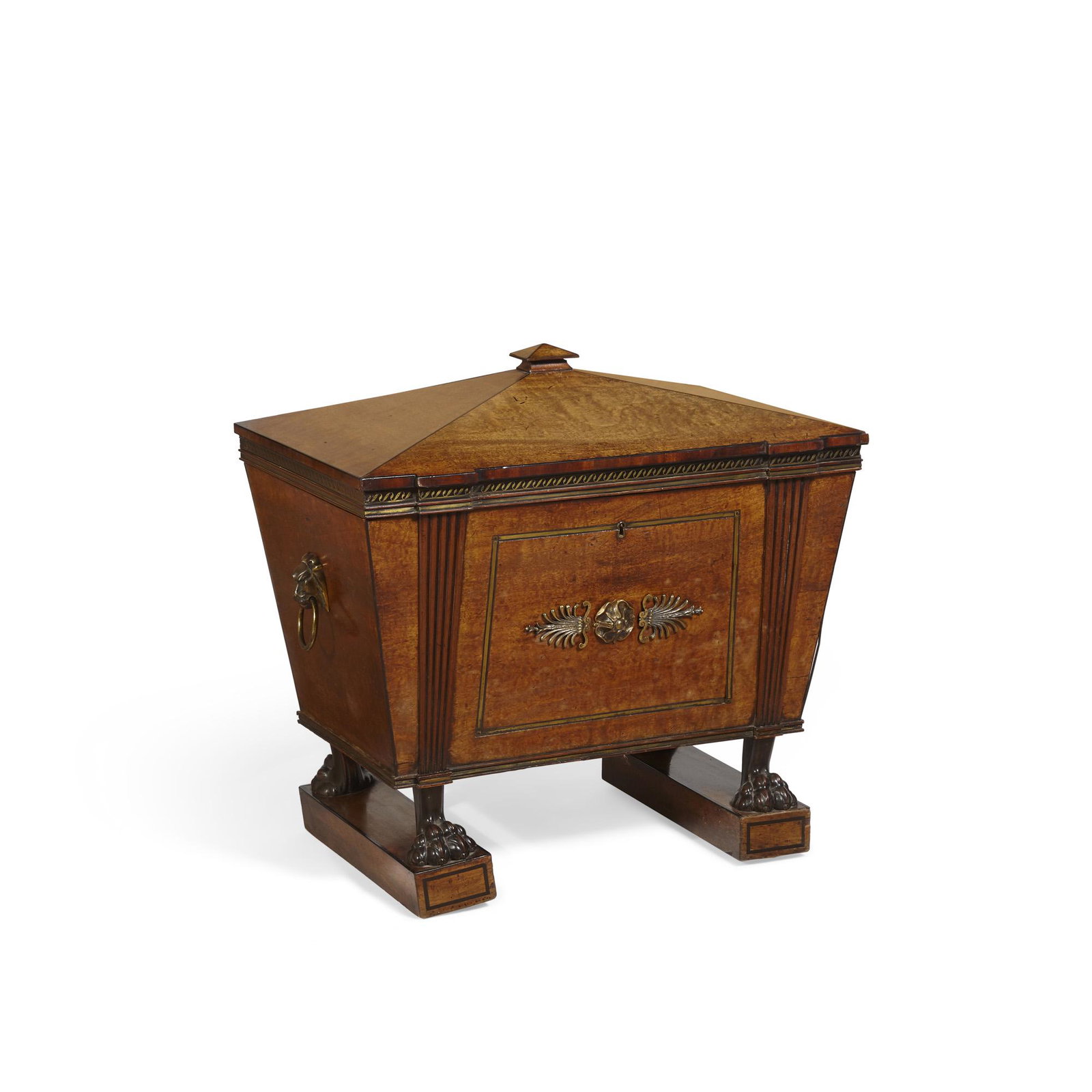 A Regency mahogany cellarette, Thomas Hope: A Regency bronze mounted and brass inlaid mahogany cellarette in the manner of Thomas Hope early 19th century The hinged coffer top above an inlaid brass and ebonized Vitruvian scroll frieze, opening 