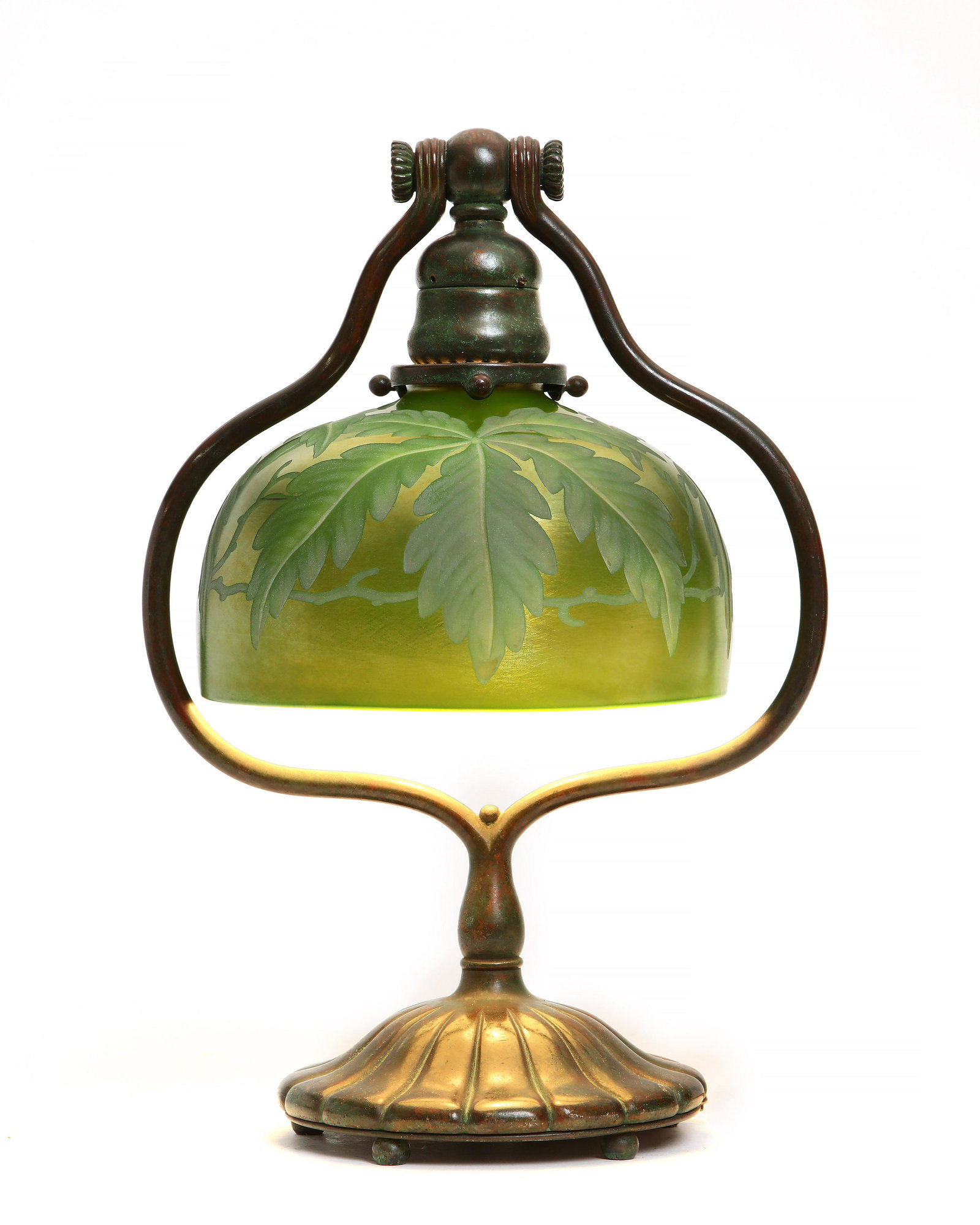 A Tiffany Studios bronze harp table lamp: A Tiffany Studios patinated bronze harp table lamp circa 1900 Underside of base stamped TIFFANY STUDIOS / NEW YORK / 419, with associated etched iridescent glass shade. height 13 1/2in (34cm); width 9