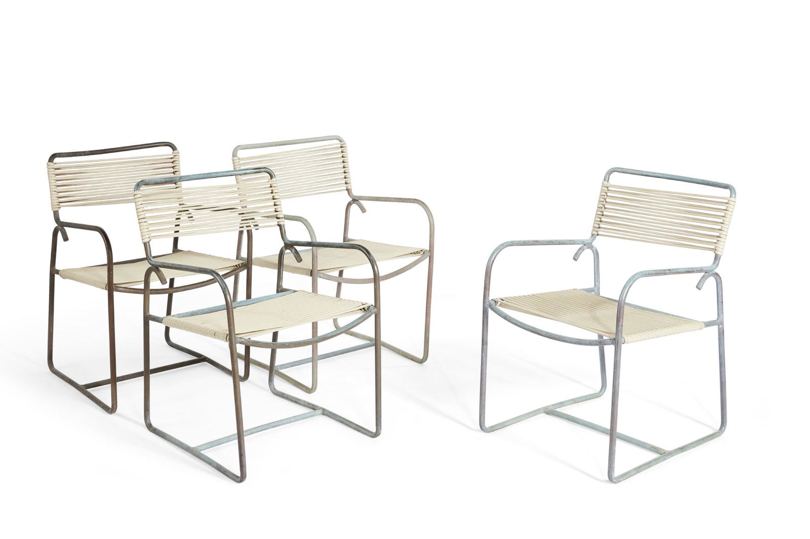 Four Walter Lamb for Brown Jordan armchairs: A set of four Walter Lamb for Brown Jordan patinated bronze armchairs post 1950 height 32 1/4in (82cm); width 21 1/2in (54.5cm); depth of seat 17in (43cm) Provenance: Property from a Private San Franc