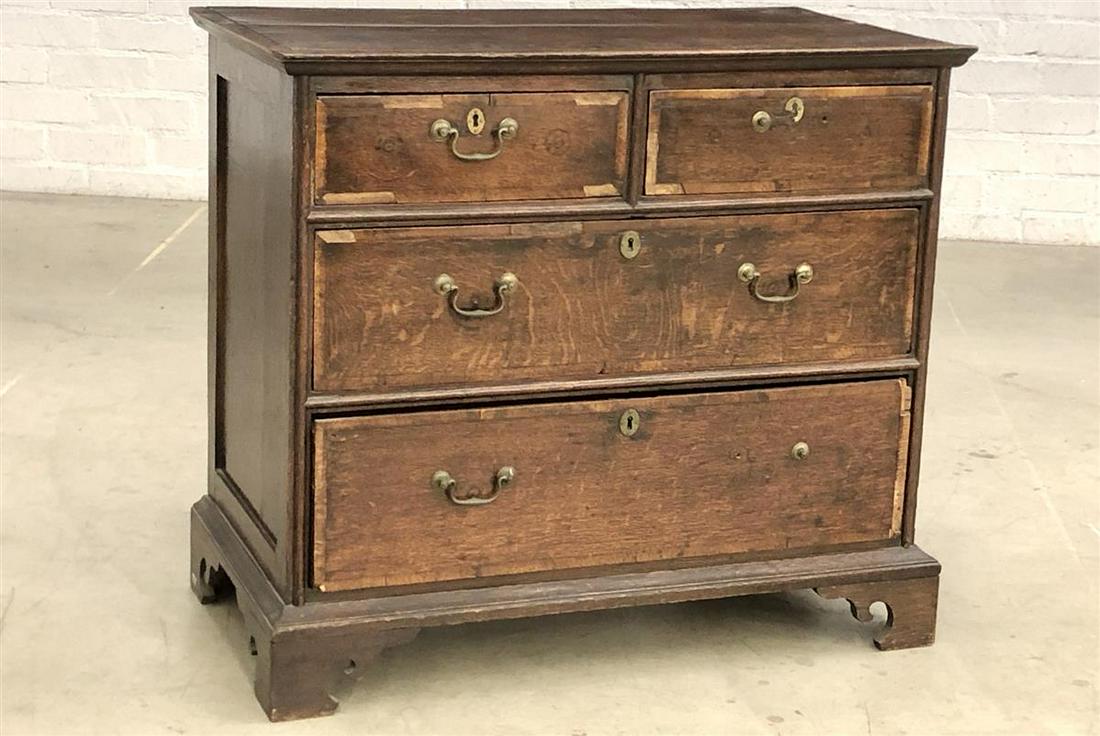 A George III banded oak chest of drawers: A George III banded oak chest of drawers late 18th century height 32 1/2in (82.5cm); width 36 1/2in (93cm); depth 20 1/2in (52cm)