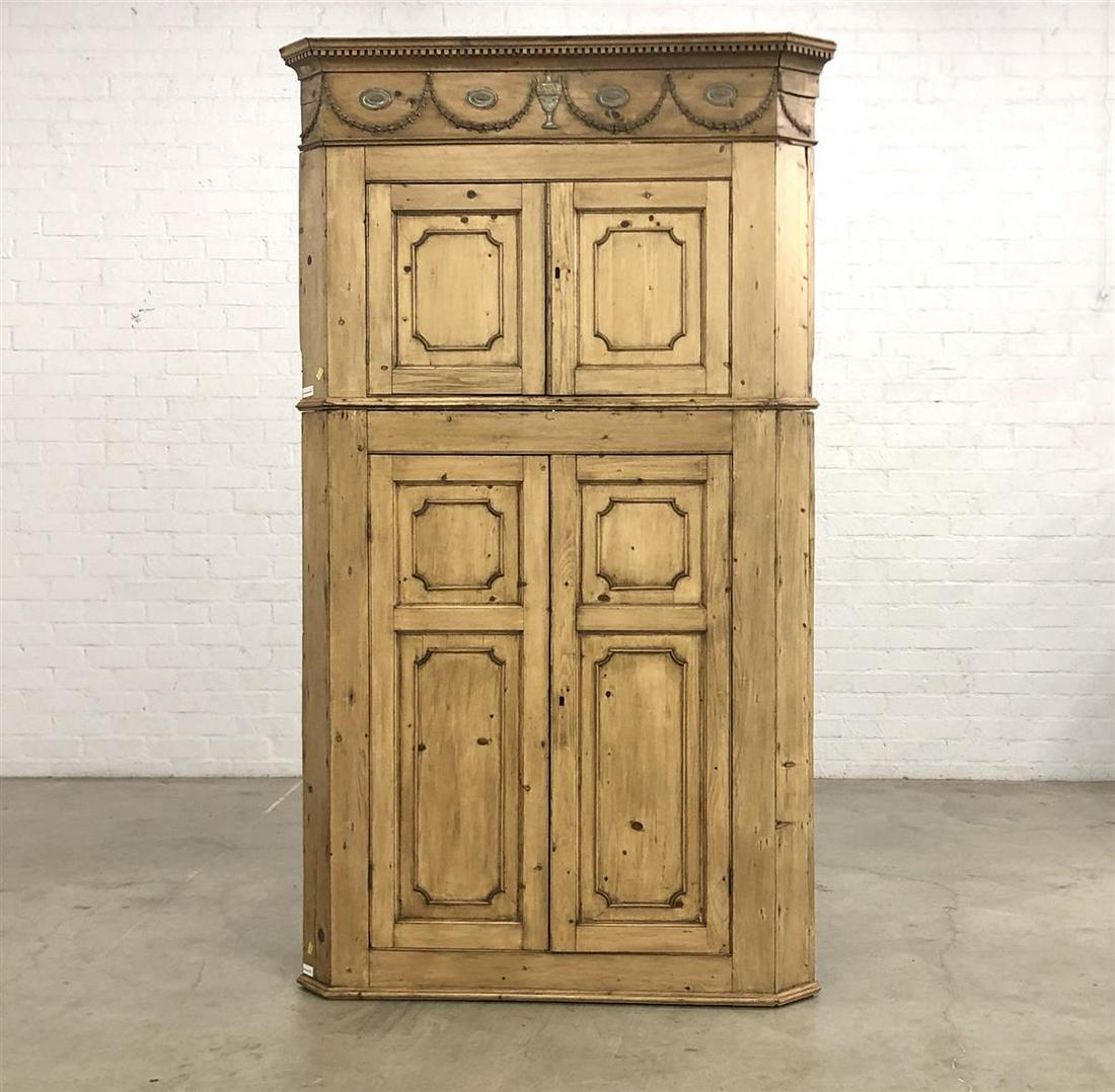 A George III metal mounted pine corner cabinet: A George III silvered metal mounted pine corner cabinet late 18th/early 19th century height 96in (244cm); width 57 1/2in (146cm); depth 28in (71cm)