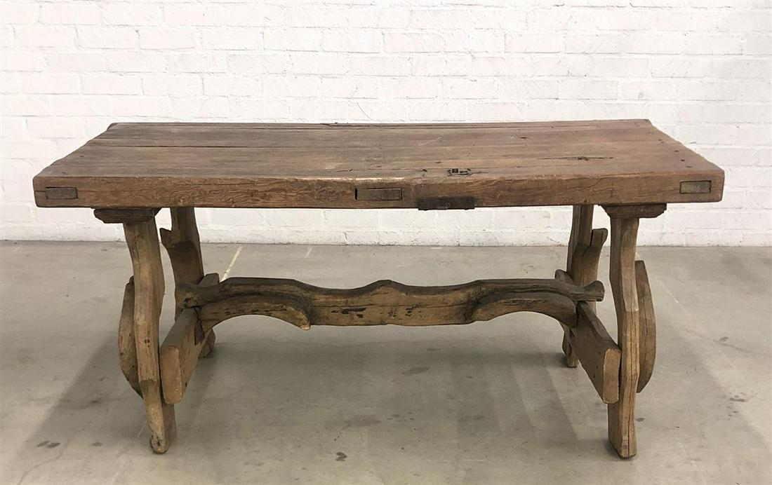 Spanish Baroque style wrought iron mounted table: A Spanish Baroque style wrought iron mounted mixed wood table comprised of antique and later elements height 31in (79cm); width 67in (170cm); depth 35in (89cm)