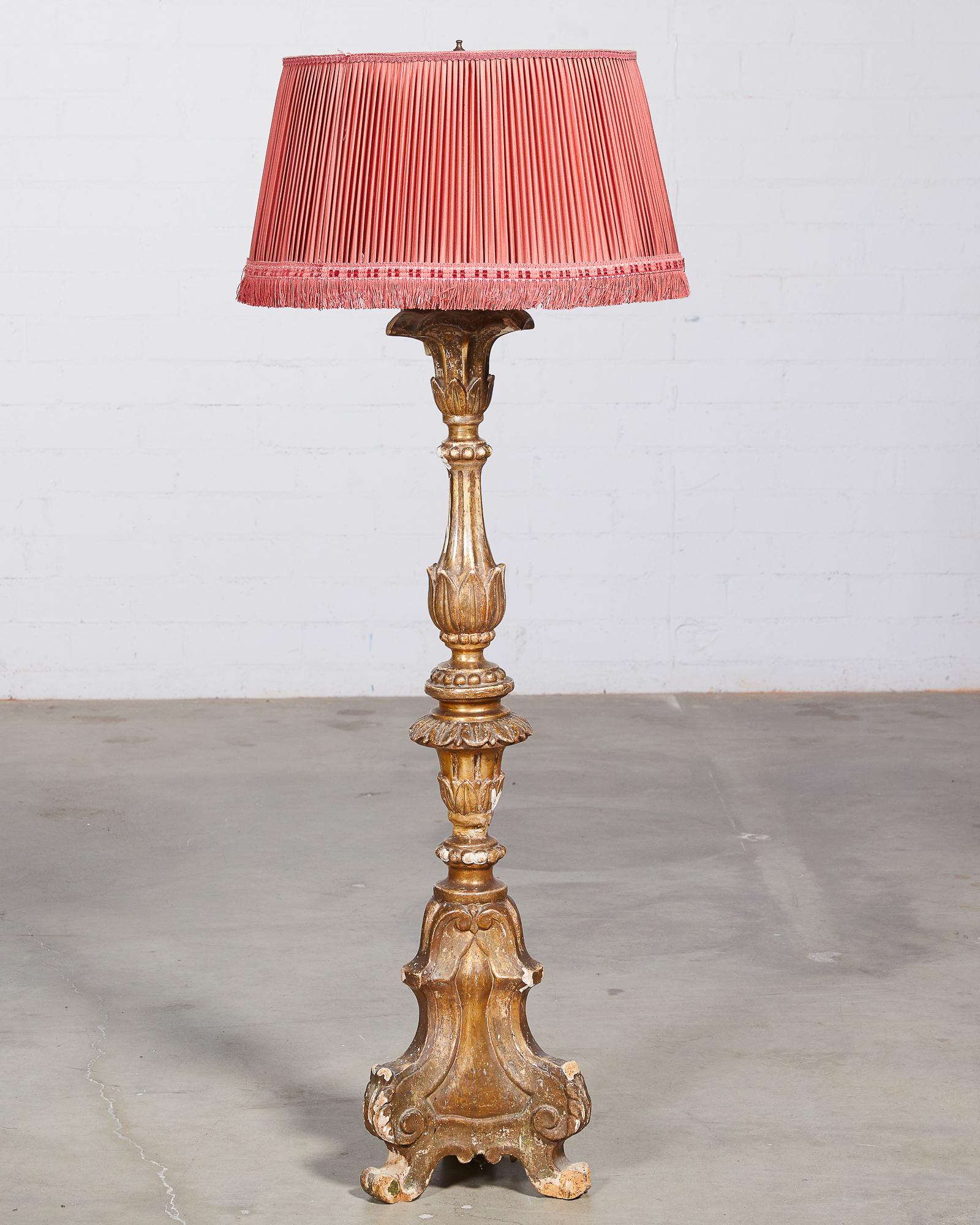 An Italian Baroque style silvered wood torchiere: An Italian Baroque style silvered wood torchiere incorporating antique and later elements overall height 55 1/2in (141cm); diameter 20 1/2in (52cm) Provenance: Property from the Collection of Fab
