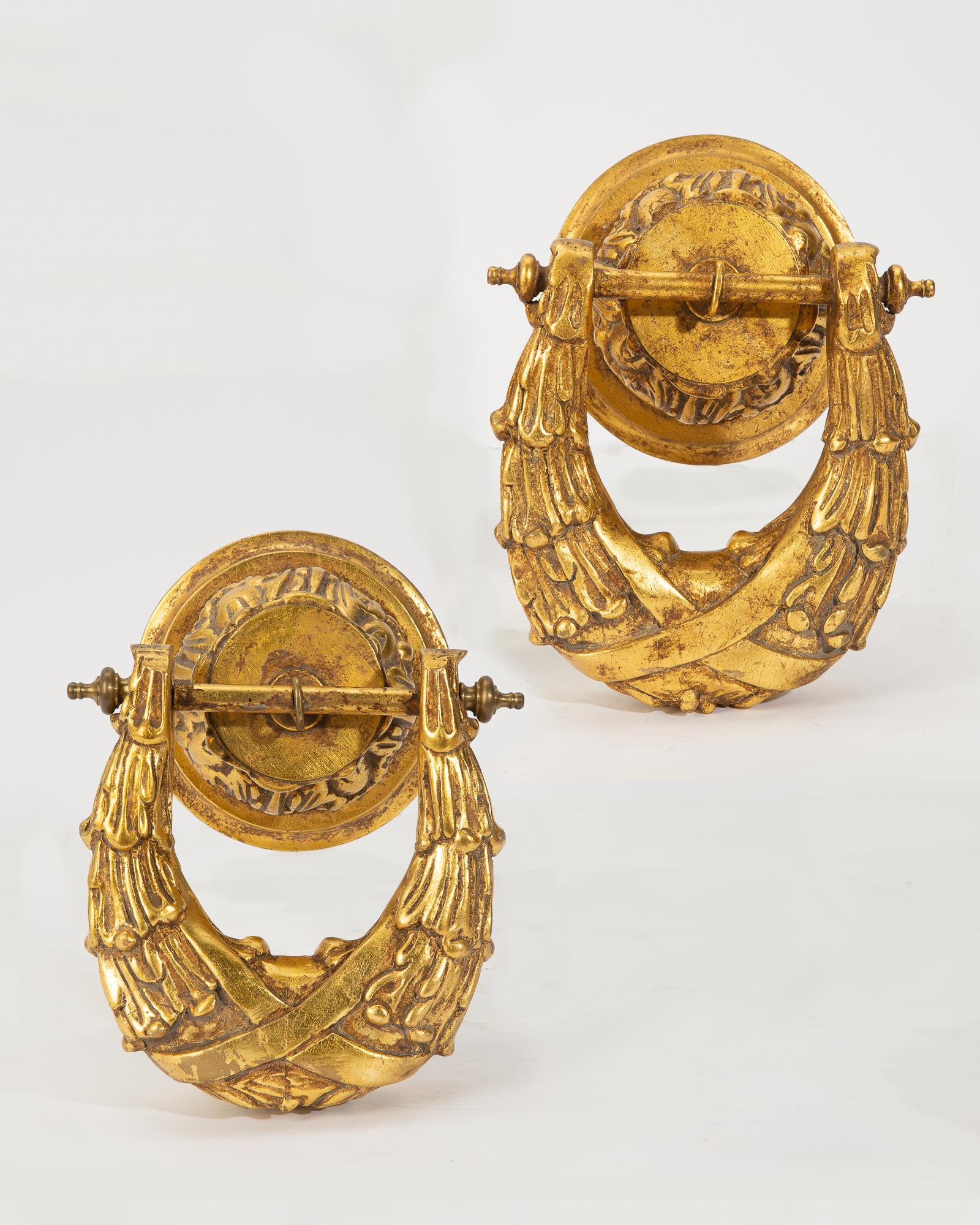 Pair of Neoclassical style giltwood appliques: A pair of Continental Neoclassical style carved giltwood wall appliques post 1950 height 12in (30.5cm); width 8 1/4in (21cm); depth 7 1/2in (19cm) Provenance: Property from a Private Collector, Pasade