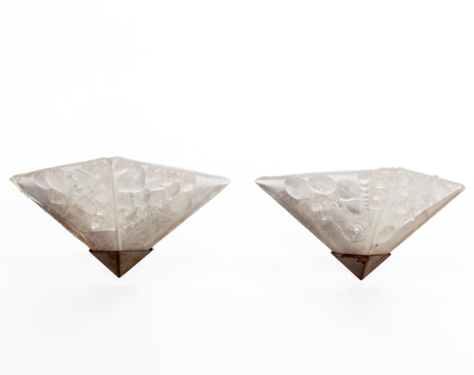 A pair of Art Deco style shell wall sconces: A pair of Art Deco style molded resin and brushed steel shell decorated wall sconces post 1950 height 7in (18cm); width 16 1/4in (41cm); depth 8 3/4in (22cm) Provenance: Property from a Private Collec