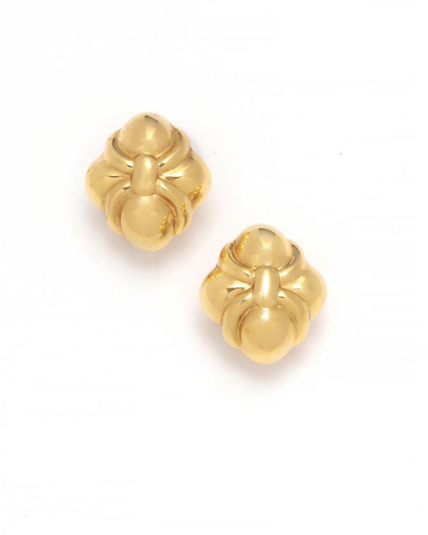 A pair of Italian 18K gold ear clips: A pair of Italian 18K gold ear clips Hollow, with posts and omega clips. 1 x 3/4in (2.5 x 2cm); weight approximately 9.2 grams Provenance: Property from the Collection of Dr. Ben Pinsky and Terry O'Ne
