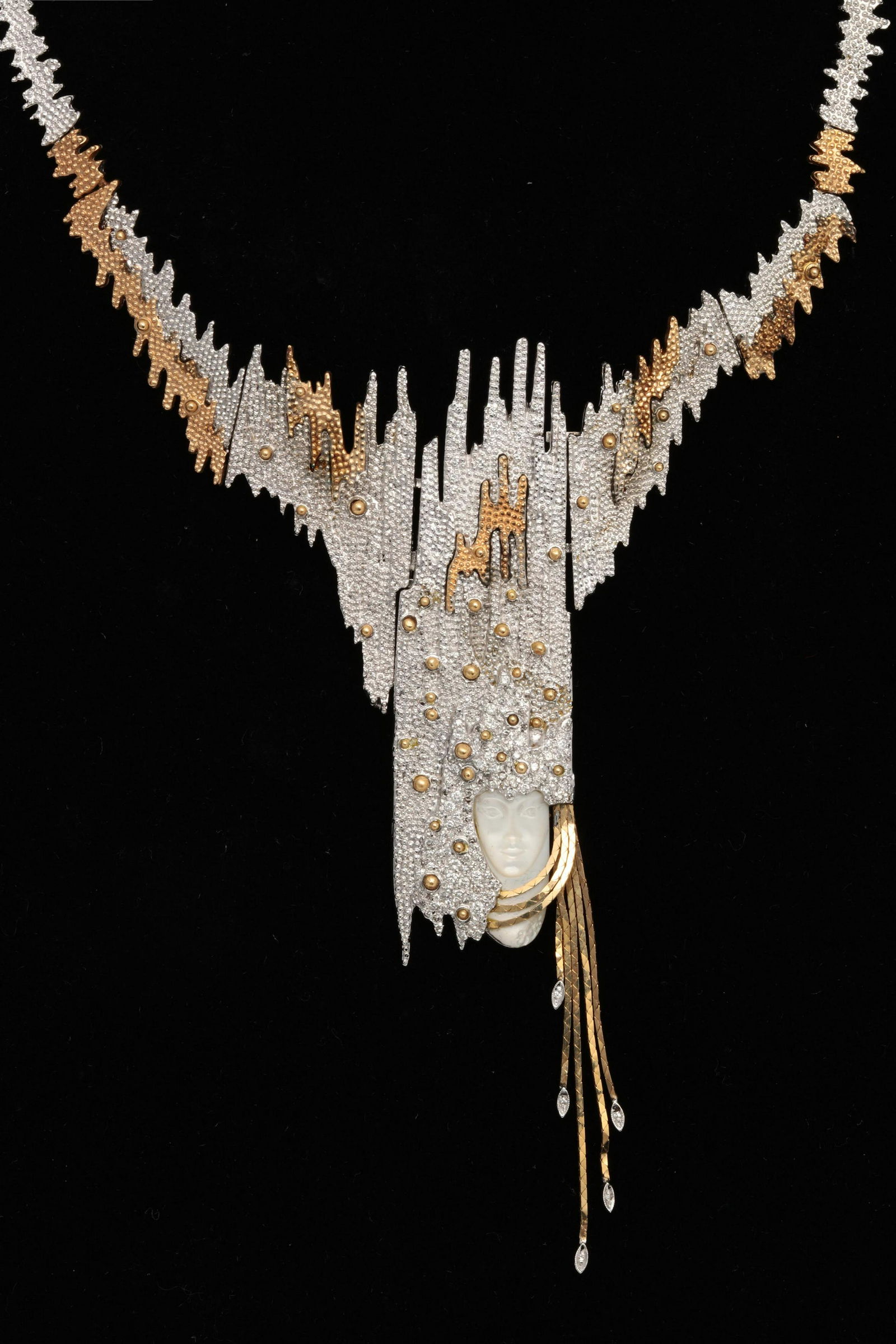 Erte: diamond, gold & silver Sophistication necklace: Erte: a mother of pearl, diamond, sterling silver and 18K gold Sophistication necklaceFeaturing a carved mother of pearl face against a diamond-set background, completed by gold accents on the silver