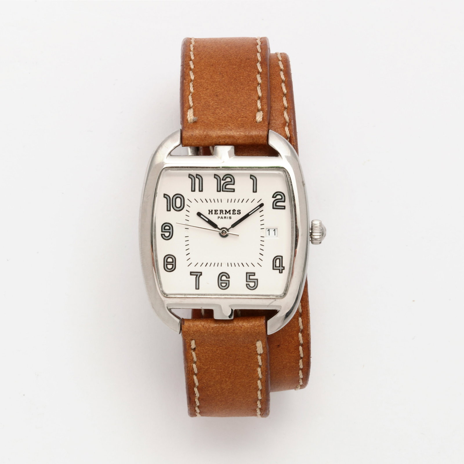 Hermes: a Cape Cod Tonneau CT1.710 leather watch: Hermes: a stainless steel Cape Cod Tonneau CT1.710 leather double strap wristwatch Dimensions 40 x 34mm, reference #2714696; Arabic numbers, stick hands, date; , with signed buckle strap length 16 1/4