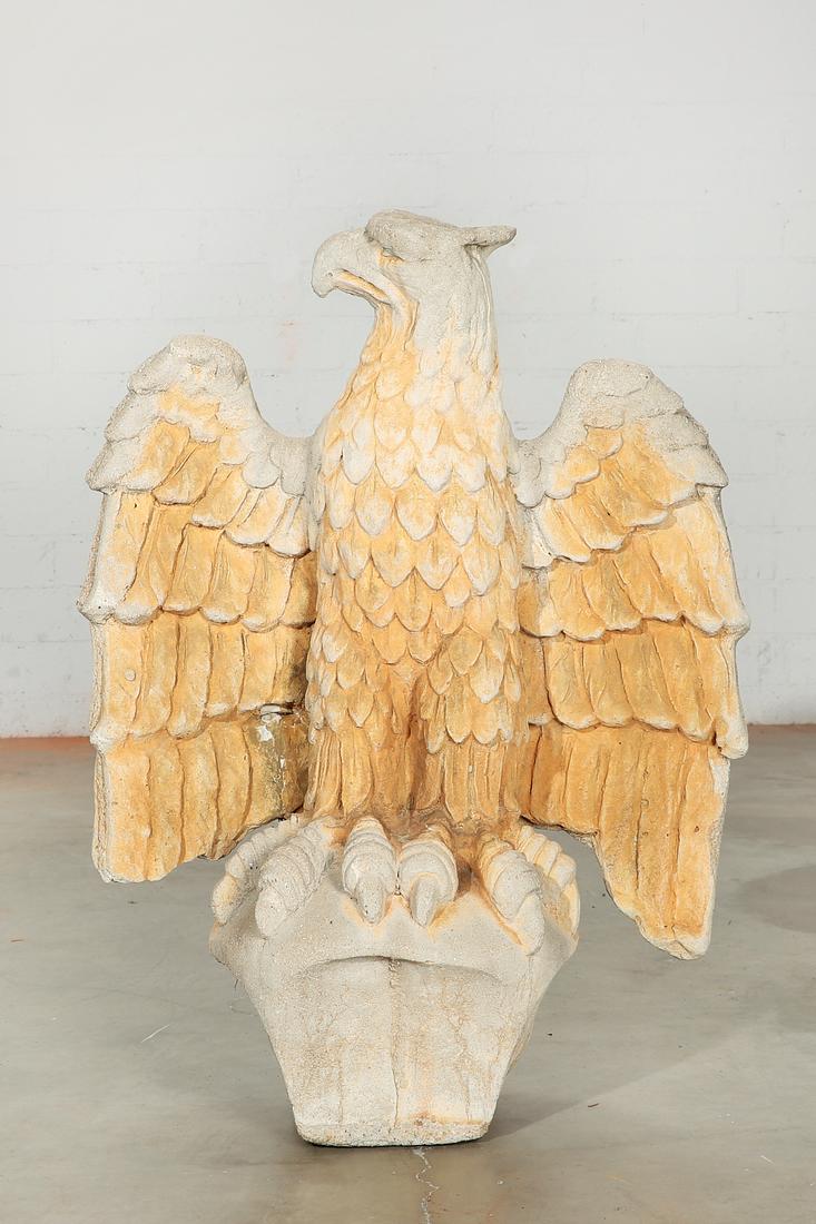 A cast stone model of a spread winged eagle: A cast stone model of a spread winged eagle post 1950 height 42in (107cm); width 31in (79cm); depth 18in (46cm) Provenance: Property from the Estate of Keith McCoy, Los Angeles, California.