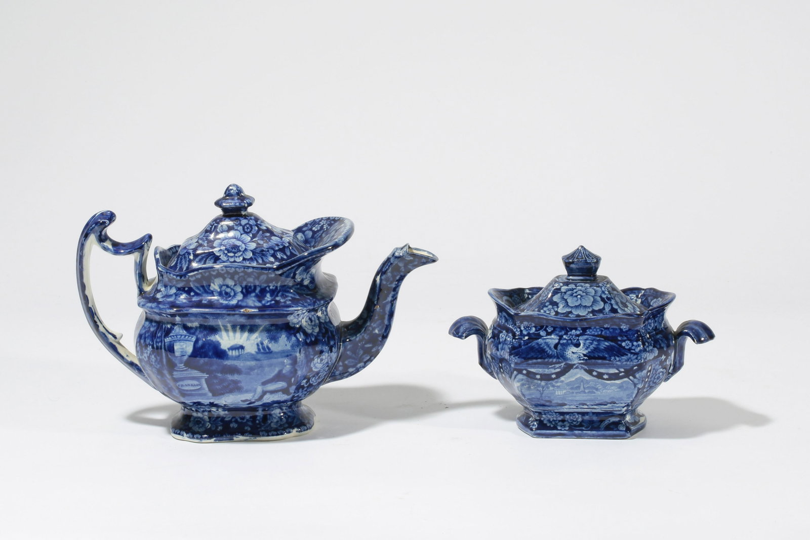A Staffordshire teapot & sugar bowl: Lafayette: A Staffordshire historical blue transfer decorated earthenware teapot and covered sugar bowl: Lafayette at Franklins Tomb first half 19th century Attributed Enoch Wood & Sons. height of teapot 7 1/2in