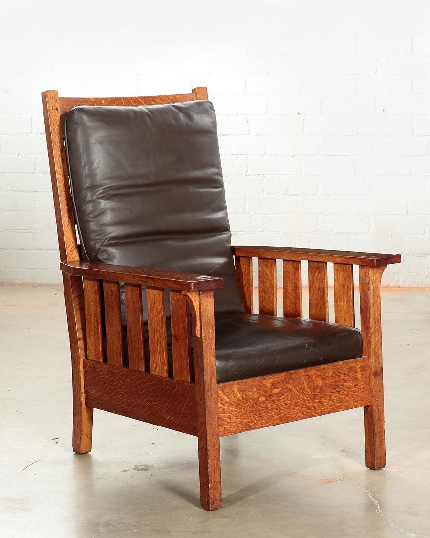 A Gustav Stickley oak armchair, model 324: An American Mission oak armchair, model #324 Gustav Stickley early 20th century With compass brand to back of seatrail. height 42 1/2in (108cm); width 29in (73.5cm); depth of seat 19in (48cm) Provenan