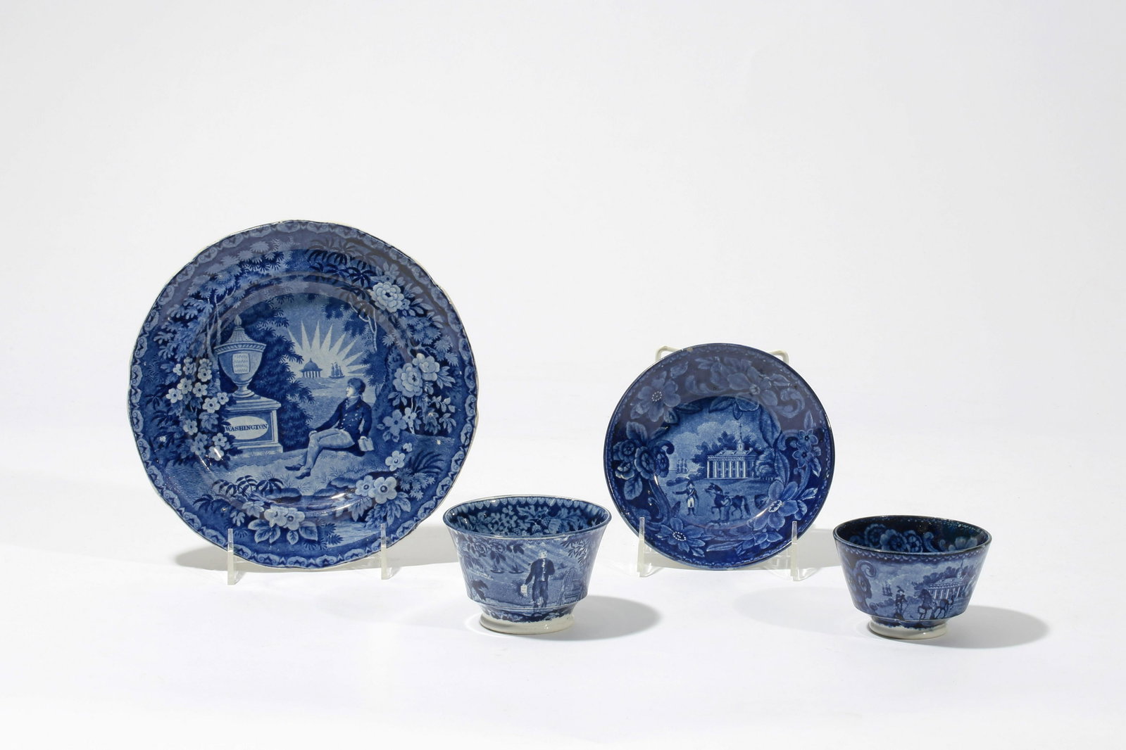 Four Staffordshire table articles, G. Washington: Four Staffordshire historical blue transfer decorated earthenware table articles of General George Washington interest first half 19th century Comprising a 8 1/2in salad plate and tea bowl depicting &