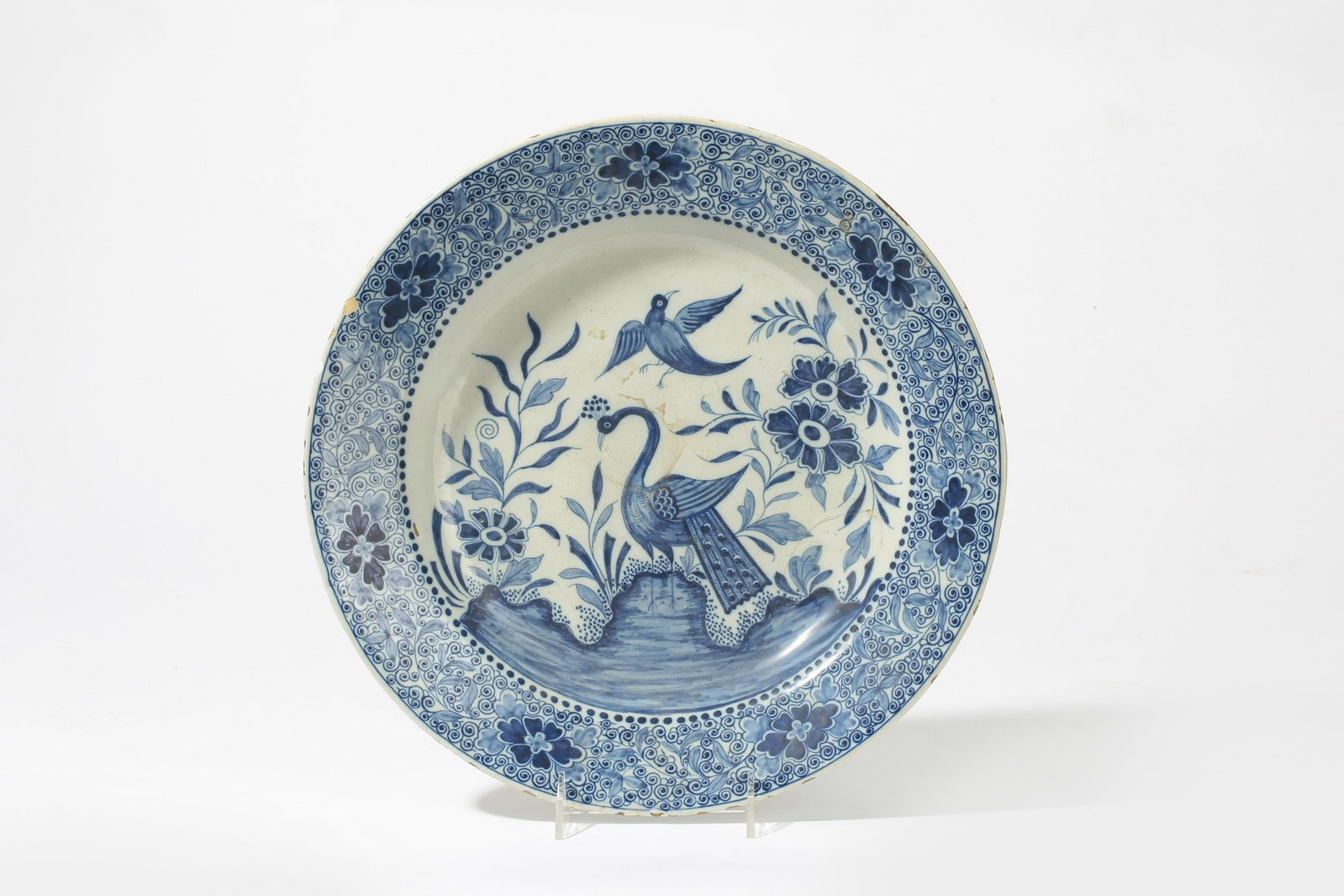 A Dutch tin glazed earthenware charger: A Dutch tin glazed earthenware charger 18th century height 2 1/2in (6.5cm); diameter 13 3/4in (35cm) Provenance: Property from a Long Beach, California Private Collection.