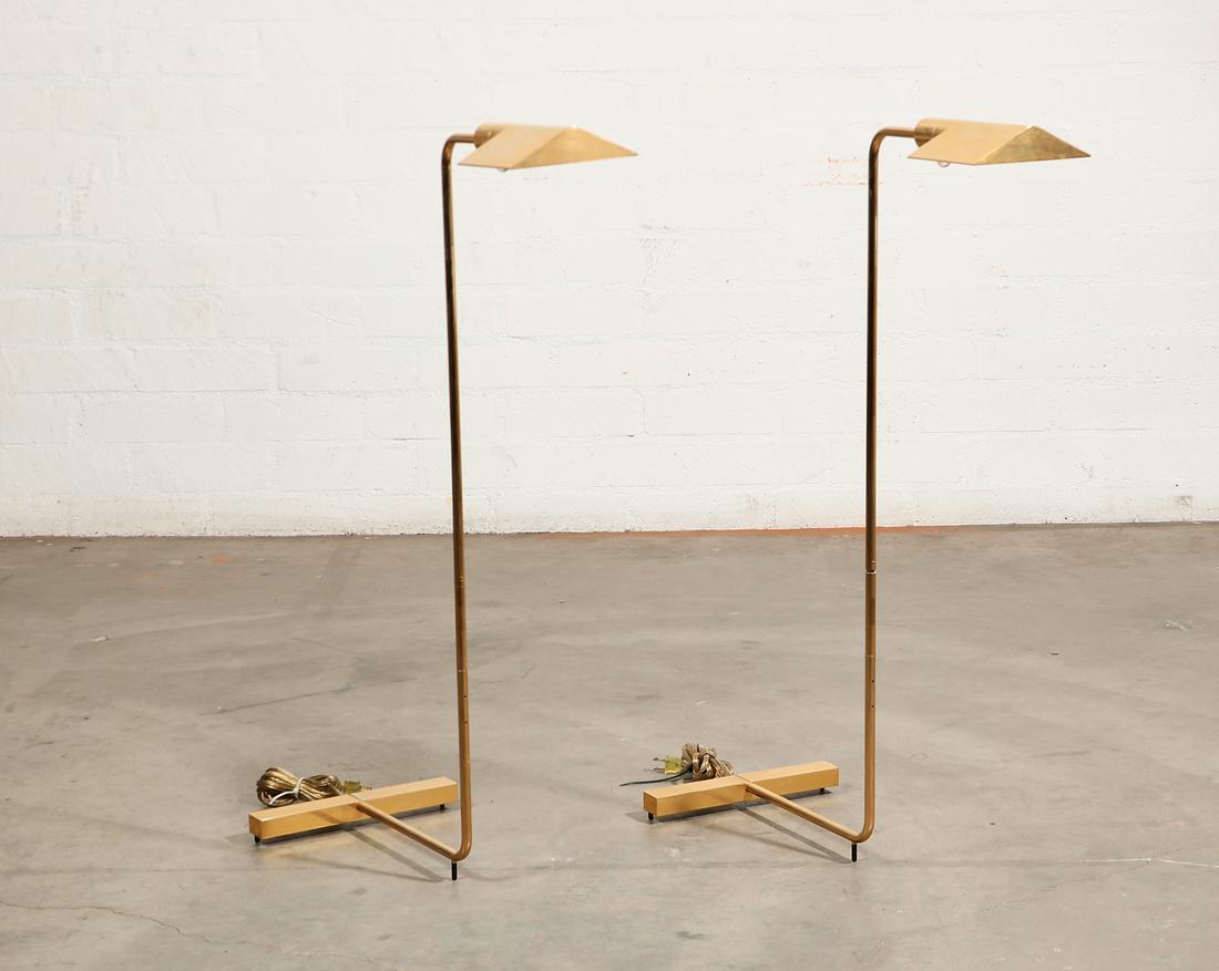 Two Cedric Hartman brass and steel floor lamps: A pair of Cedric Hartman brass and stainless steel floor lamps20th centuryBoth impressed with manufacturers mark to underside, MADE IN USA and numbered 000007.height 36 1/4in (92cm)
