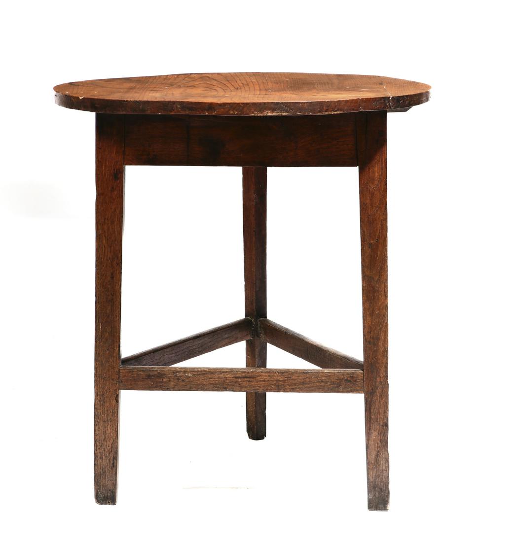A George III elm and oak cricket table: A George III elm and oak cricket tablelate 18th centuryheight 25 3/4in (65.5cm); diameter 23 3/4in (60.5cm) Provenance: Property of a Private Southern California Collection.