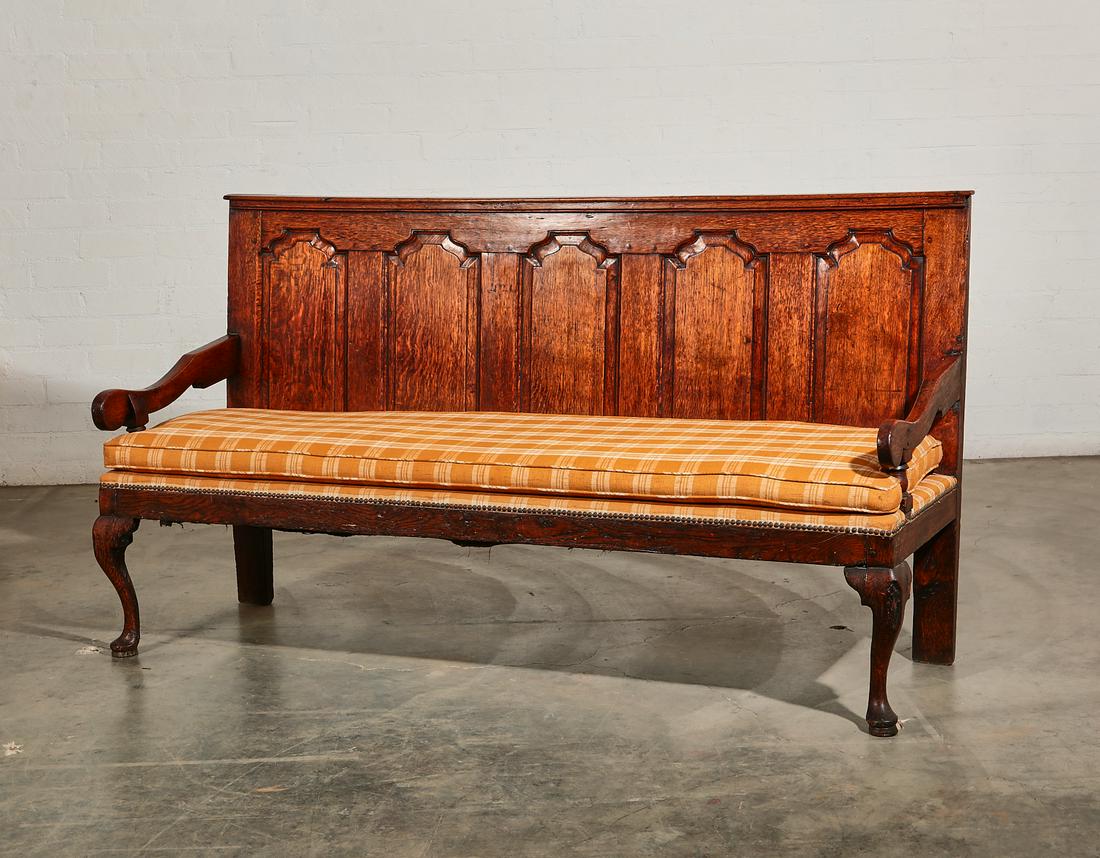 A George III oak quadruple chair back settle: A George III oak quadruple chair back settle probably Welsh late 18th century 41in (104cm); width 73in (185.5cm); depth of seat 20 1/2in (52cm)