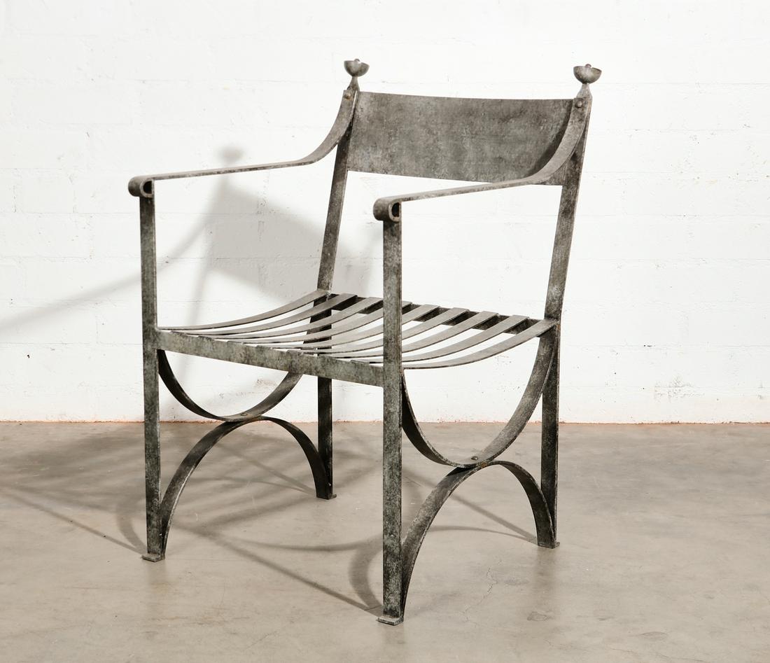 A patinated metal garden armchair: A patinated metal garden armchairheight 33 1/2in (85cm); width 22in (56cm); depth of seat 19in (48cm) Provenance: Property from the Estate of Keith McCoy, Los Angeles, California.