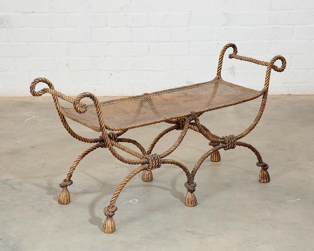 A Neoclassical style gilt iron window bench: A Neoclassical style gilt iron rope-twist window bench post 1950 height 23 1/2in (60cm); width 45 1/2in (115.5cm); depth of seat 15in (38cm)