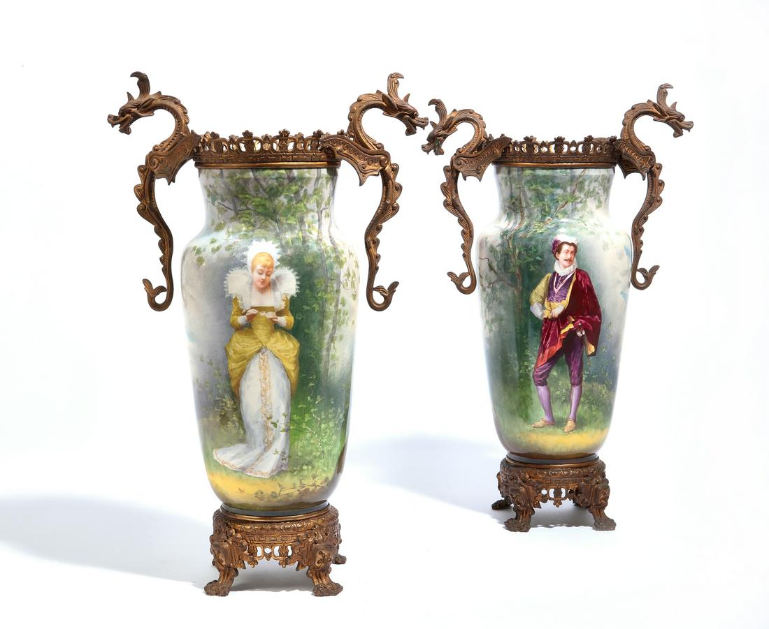 A pair of Continental earthenware vases: A pair of Continental gilt metal mounted earthenware vases late 19th/early 20th century height 19in (48cm); width across handles 11 3/4in (30cm); depth 7in (18cm)
