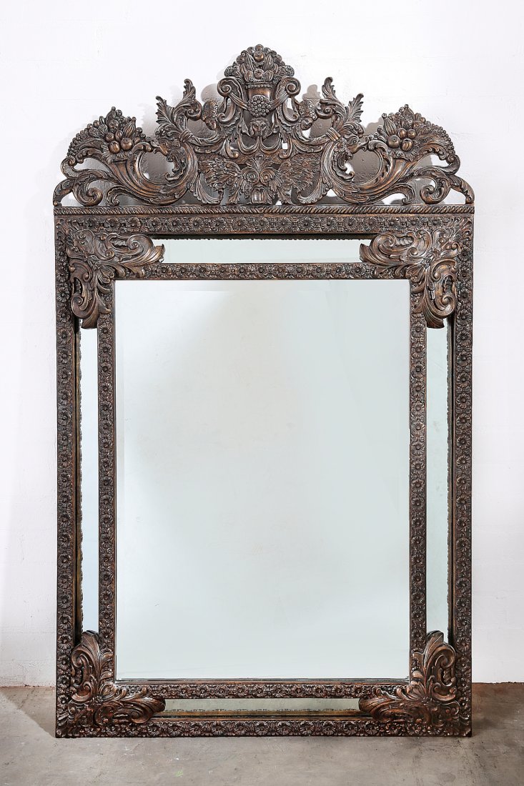 A Continental Baroque style mirror, modern: A Continental Baroque style mirror modern height 71 1/2in (181.5cm); width 42in (106.5cm)