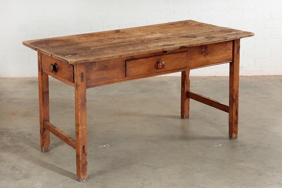 An American pine table, 19th century: An American pine table19th centuryWith frieze drawer to one side and another to one end.height 30 1/4in (77cm); width 54in (137cm); depth 26 1/2in (67cm) Provenance: Property from the Estate of Keith