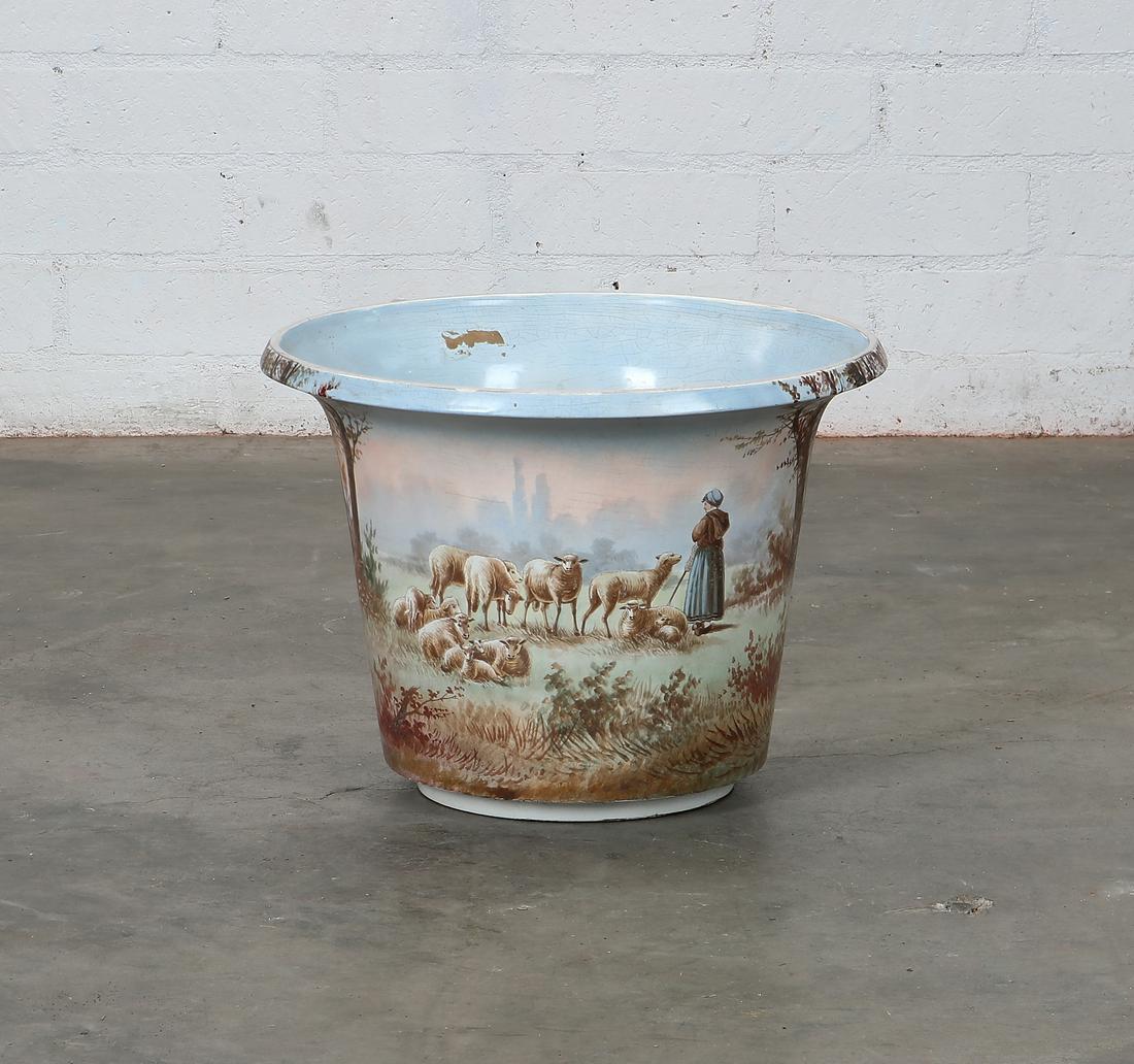 A French painted earthenware jardiniere: A French painted earthenware jardiniere height 13 1/2in (34.5cm); diameter 18in (46cm) Provenance: Property from the Collection of Raymond Enkeboll.