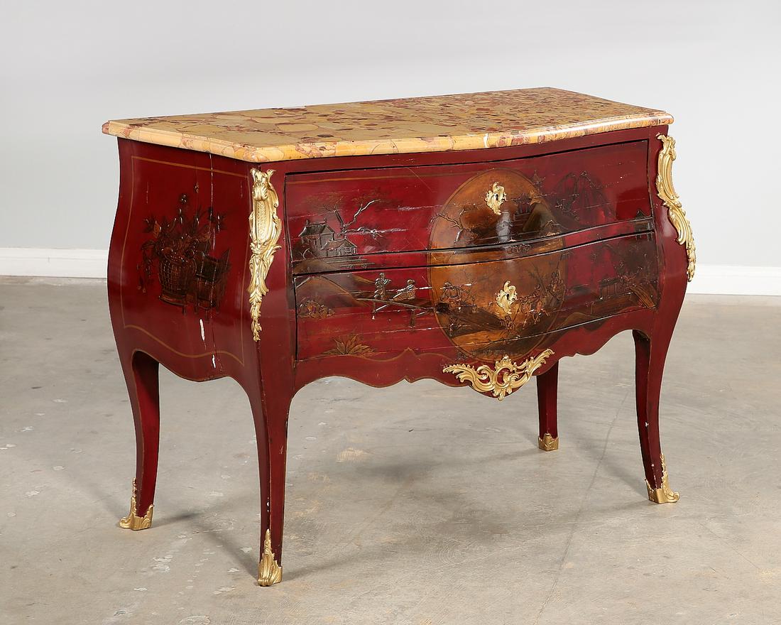 A Louis XV style Chinoiserie decorated commode: A Louis XV style Chinoiserie decorated scarlet lacquered commode20th centuryheight 34in (86.5cm); width 44 1/2in (113cm); depth 23 1/4in (59cm) Provenance: Property from the Estate of June Ebensteiner