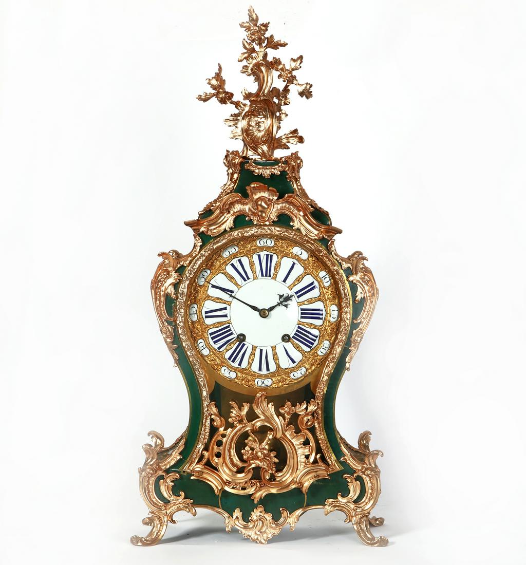 A Louis XV style mantel clock, Cherier: A Louis XV style gilt bronze mounted green lacquered mantel clock Cherier, Paris late 19th century The twin train movement striking on a bell, inscribed Cherier Paris height 37in (94cm); width 16in (4
