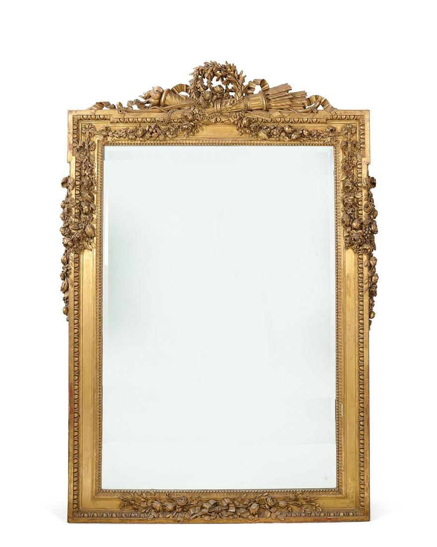An imposing Neoclassical style giltwood mirror (1 of 2)