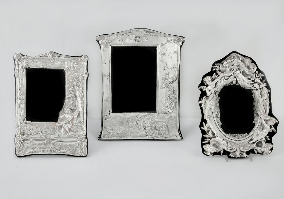 Three sterling silver table top picture frames: Three sterling silver table top picture framesmodernthe largest height 13 1/4in (33.5cm); width 10 1/4in (26cm)