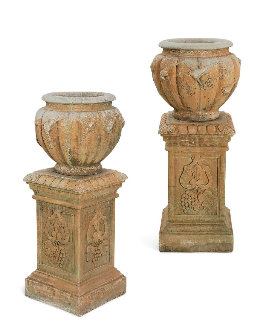 A pair of Japanese style tinted stone jardineres: A pair of Japanese style tinted stone jardineres on associated pedestalspost 1950overall height 46 1/2in (118cm); width 19in (48cm) Provenance: Property from a historic Beverly Hills residence.