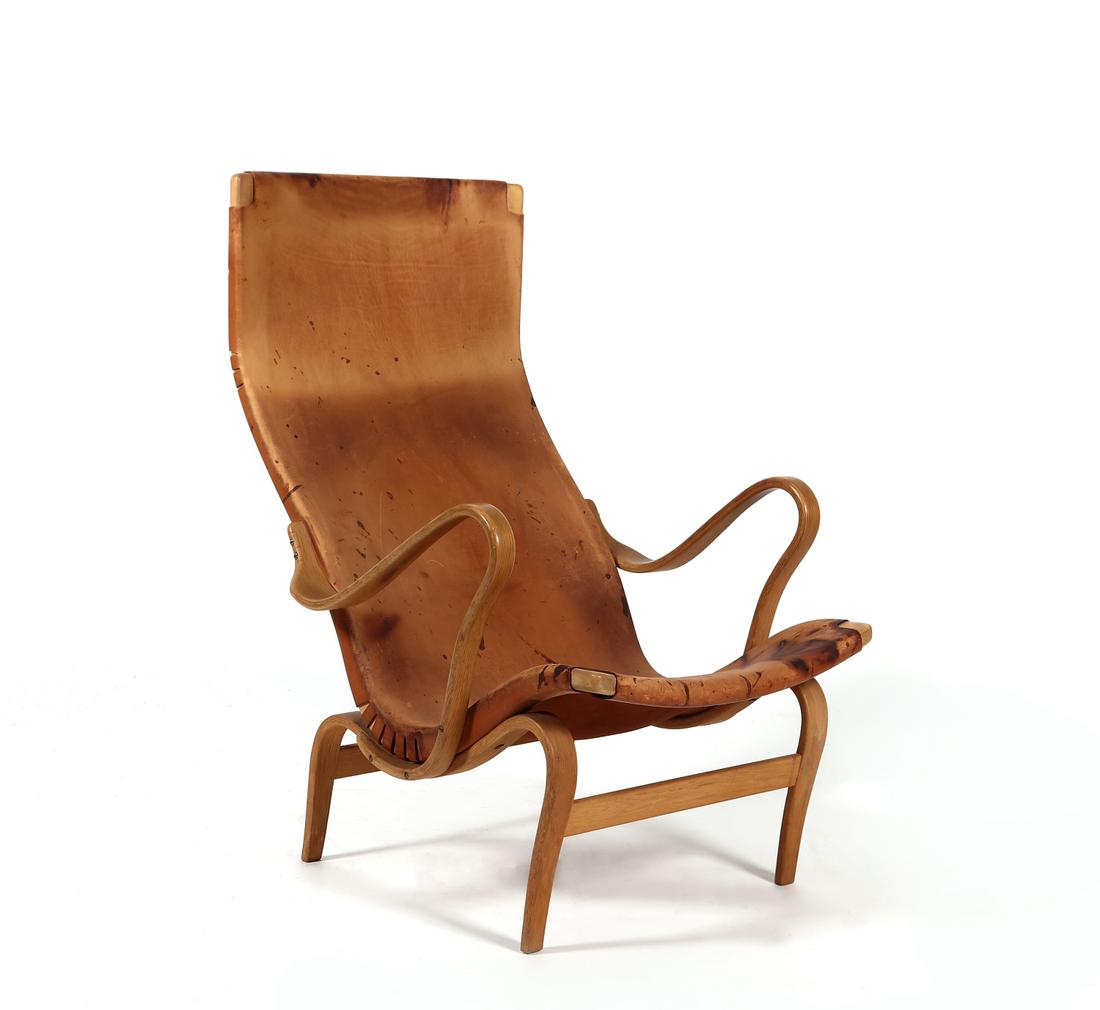 Bruno Mathsson Pernilla lounge chair, Sweden 1968: A Bruno Mathsson Pernilla 2 beech plywood and leather lounge chairKarl MathssonSweden, 1968Stamped twice to the back stretcher Firma Karl Mathsson 1968 and Bruno Mathsson design / Made In Sweden.heigh